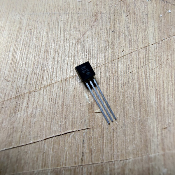 NPN transistor sitting on a wooden table