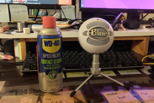 Blue Snowball Ice USB microphone standing next to can of WD-40